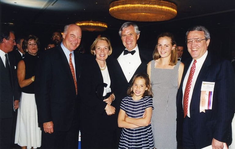 Mike Armstrong, Barbara and Amos Hostetter, two children, and Leo Hindery at the 1999 NCTA Cable Show.