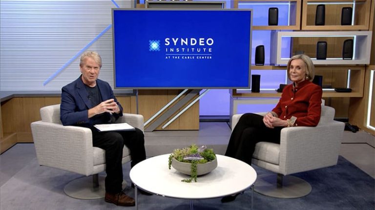 Studio set with Stewart Schley interviewing Cathy Rasenberger, President, Rasenberger Media LLC, and Co-Founder, Sports Studio Inc., for the Women In Cable Archive