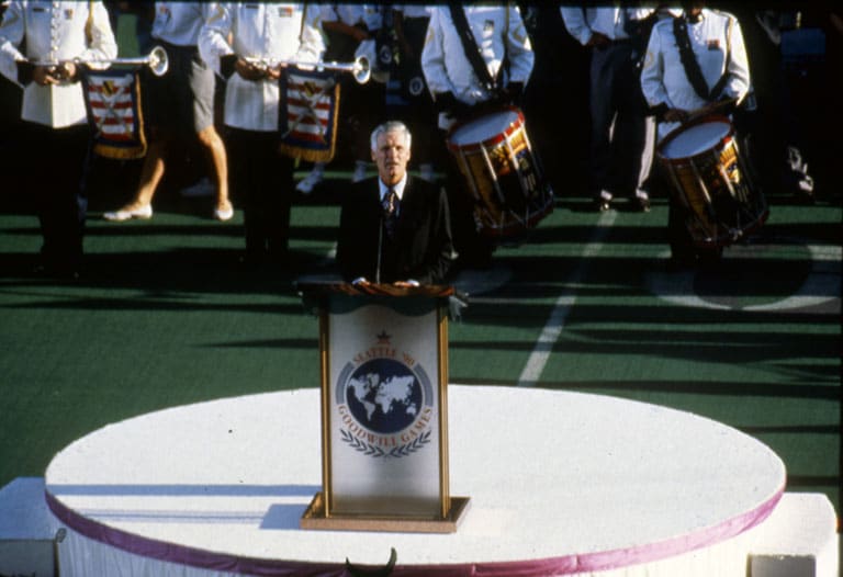 Ted Turner at podium - 1990 Goodwill Games opening ceremony